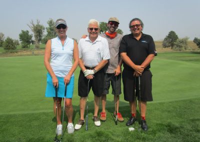 A group of people golfing