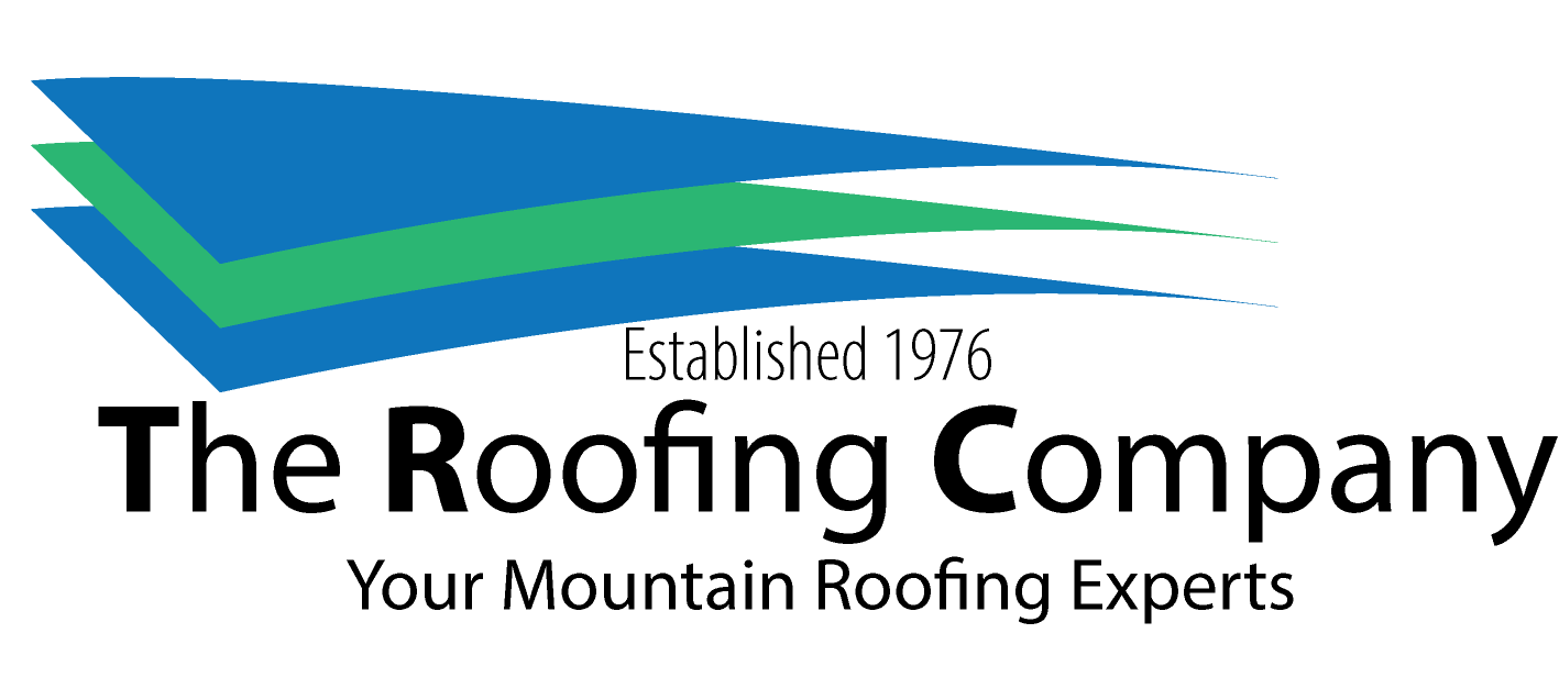 Logo for The Roofing Company featuring blue and green overlapping roof shapes above the text "Established 1976 The Roofing Company Your Mountain Roofing Experts" on a light background.